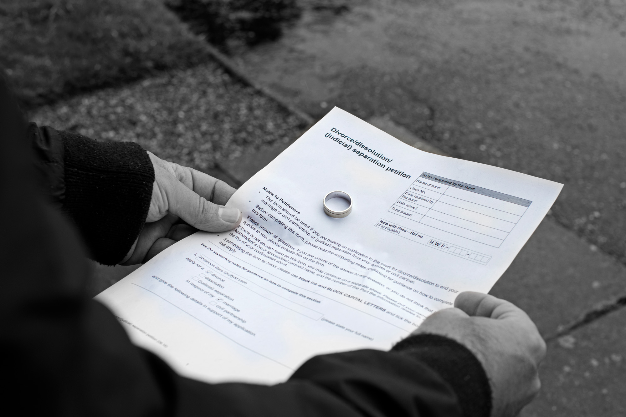 A person holding a document titled 
