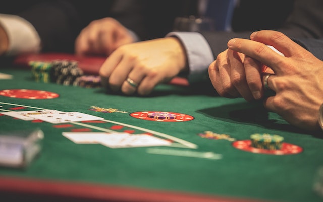 people sitting at poker table