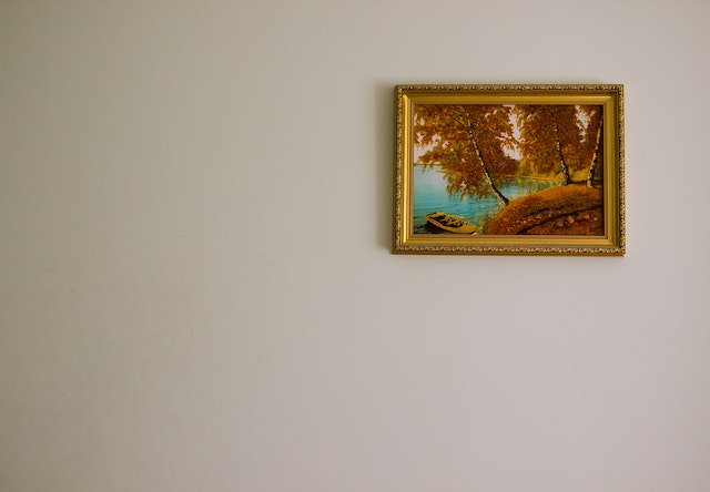 painting in gold frame on wall