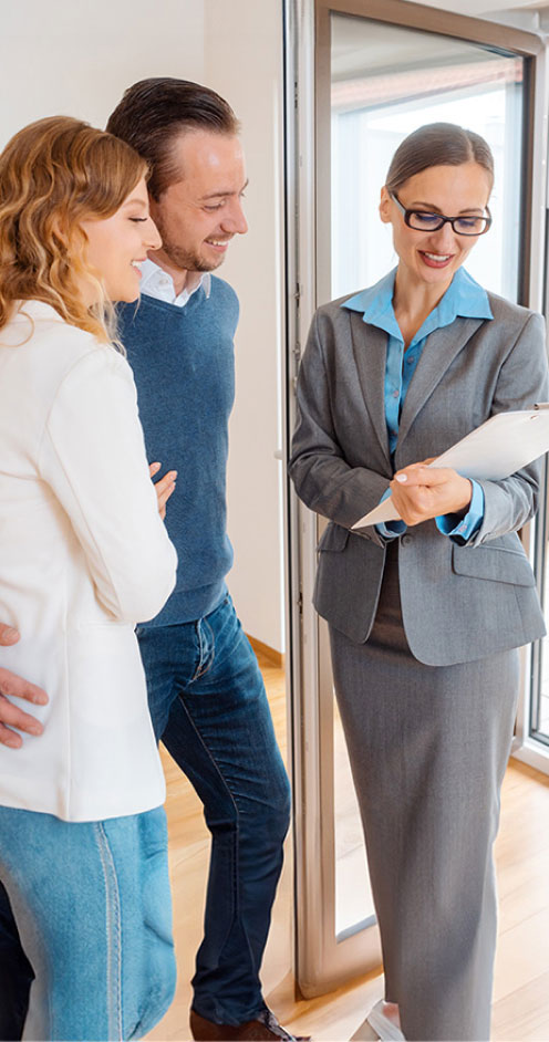 Landlady or realtor showing lease agreement to new tenants 2