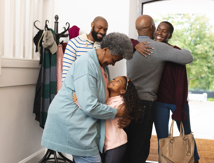 happy multi generation african american family entering house 1