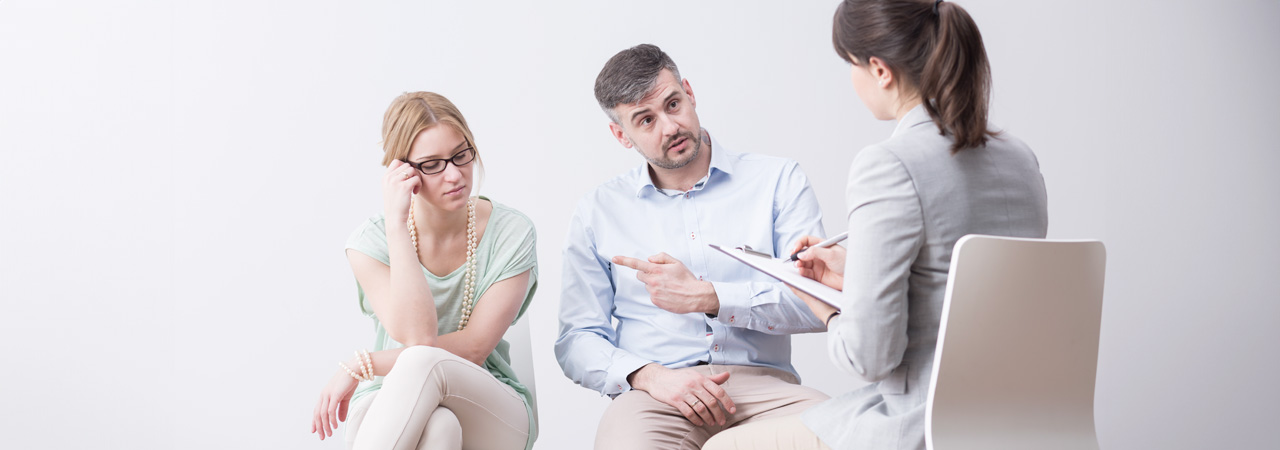 couple during a therapy session sitting in a very bright room