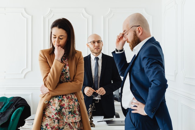 stressed couple near lawyer
