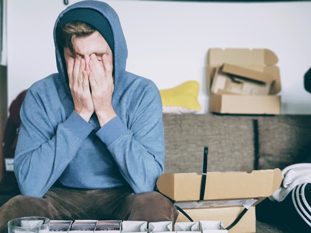 sad child sitting on couch