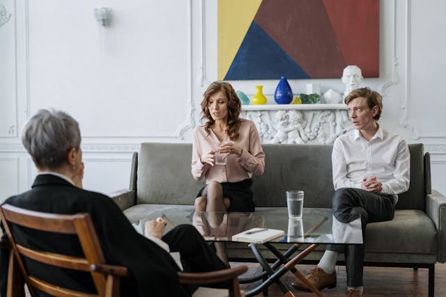 couple talking with third person