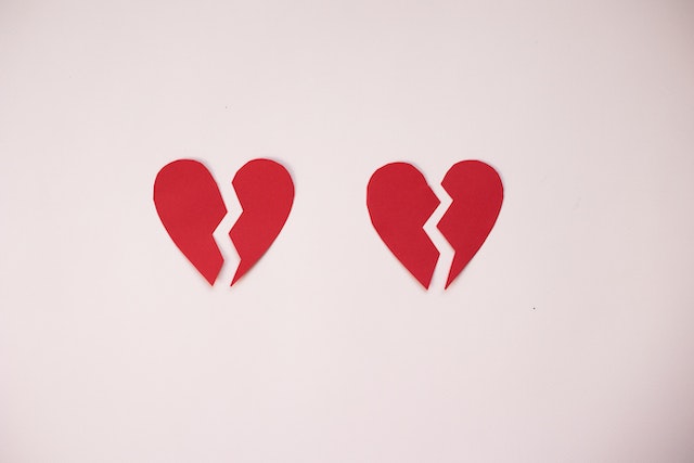 broken hearts on pink background
