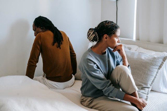couple sitting back to back