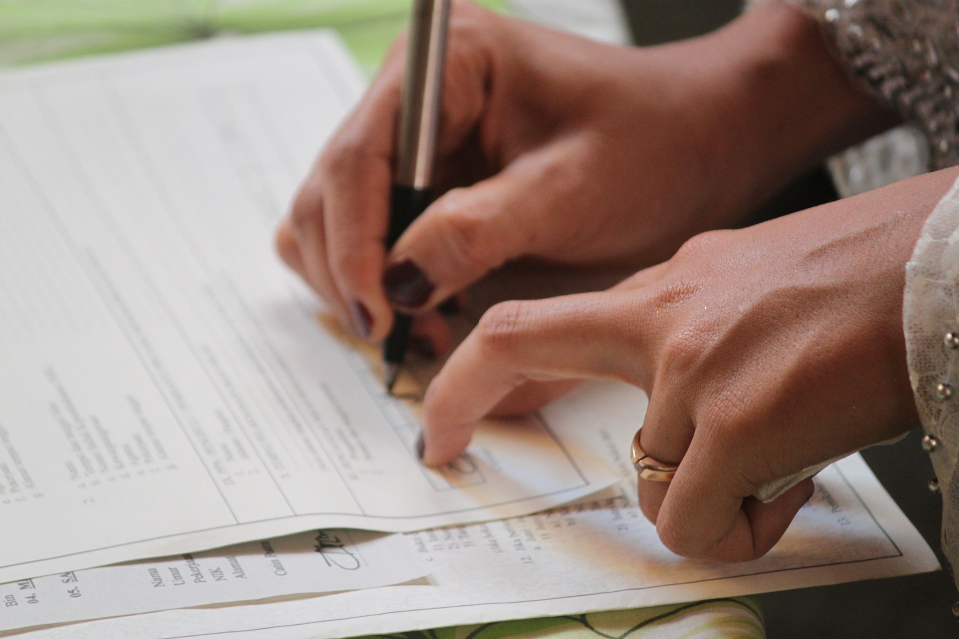 woman signing document